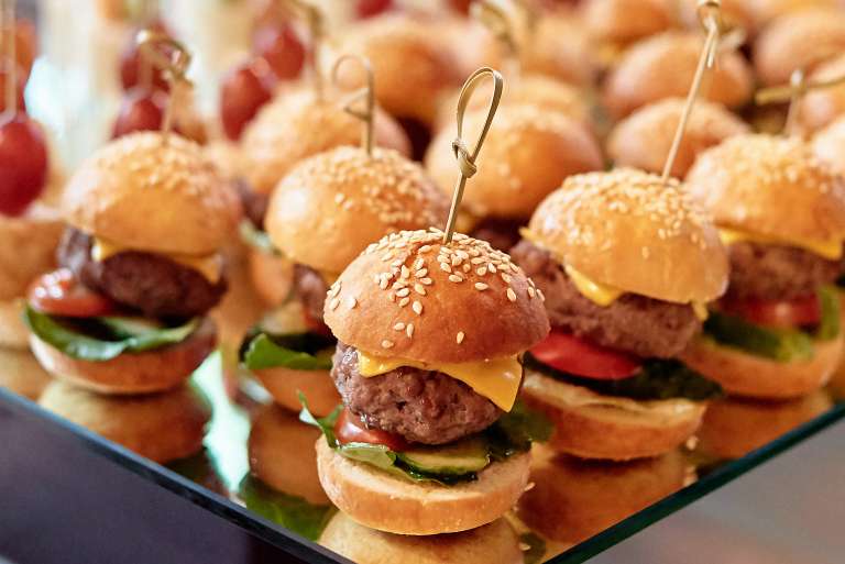 Buffet table with mini hamburgers at luxury wedding reception, copy ...